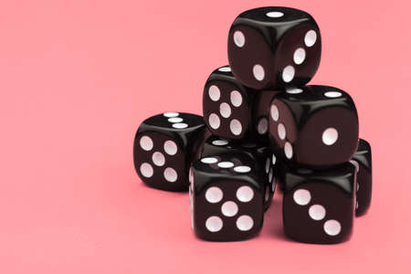 Gaming dice on pink background. Concept for games.の写真素材