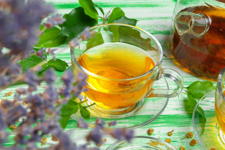 Black tea on green wooden backgroundの写真素材