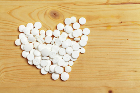 Assorted pharmaceutical medicine pills, tablets on wooden backgroundの写真素材