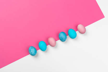 Candy color easter eggs over bright paper background