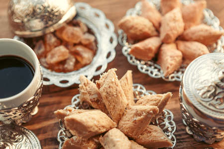 Turkish sweets with coffee on a wooden table