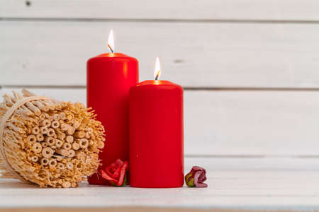 home lighting candles on wooden tableの写真素材