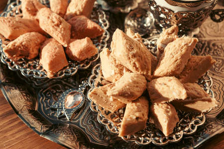Turkish sweets with coffee on a wooden table