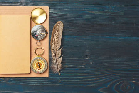 Travel items on wooden table.