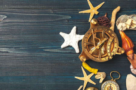 seashells and compass. beautiful sea composition with shells and vintage compassの写真素材