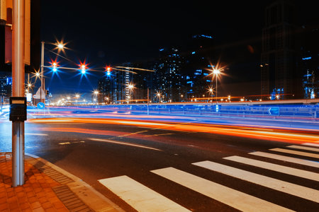 Long exposure of moving cars on night road in Dubai