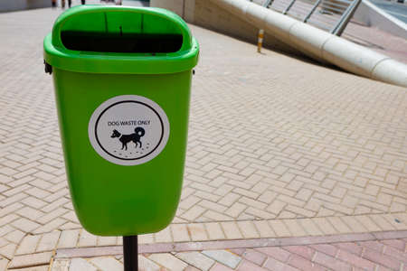 Green recycle bin for dog waste in Dubaiの写真素材
