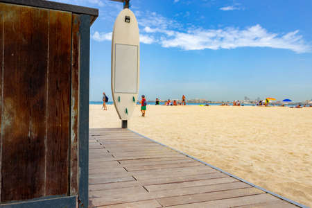 Background of people walking on the beach on sunny dayの写真素材