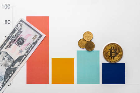 Bitcoin coin on stock market charts papersの写真素材