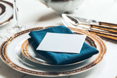 Close up shot of table setting for fine dining with cutlery and glassware