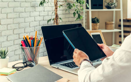 Close up of a working table of a businessman with laptop