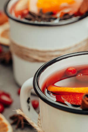 Christmas composition with hot mulled wine in rustic cupの写真素材