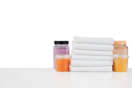 Composition of cosmetic bottles and towels isolated on whiteの写真素材