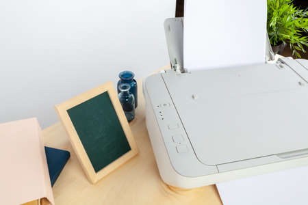 Hands of a woman using a copying machine close up