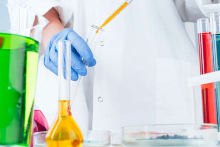 Scientist working with chemical samples in laboratory close up