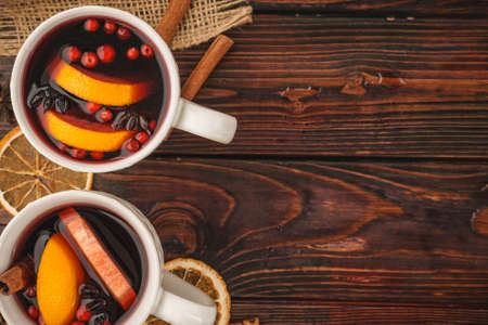 Christmas composition with hot mulled wine in rustic cupの写真素材