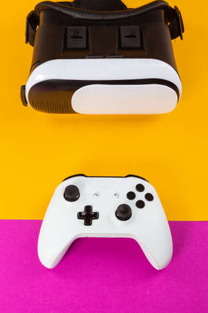 VR Headset on color table background