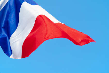Flag of France waving in the wind in the skyの写真素材
