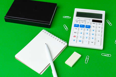 Green office desk with white stationery, copy spaceの写真素材