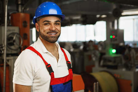 Portrait of a smiling handsome african american factory workerの写真素材