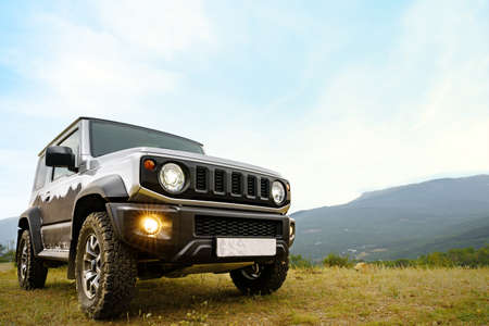 Dark gray off-road car in the mountainsの写真素材