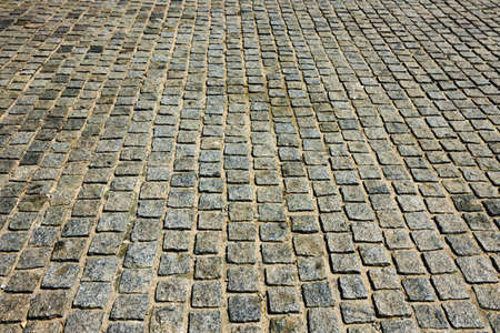 Street floor textured tiles as a backgroundの写真素材