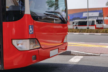 A close up shot of a regular old red busの写真素材