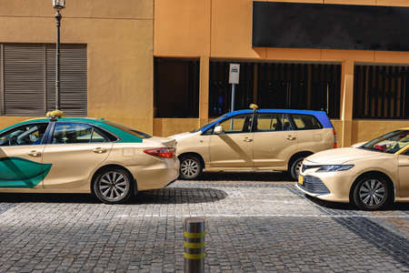 Taxi car parked at downtown in Dubai. United Arab Emirates