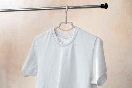 Plain white cotton t-shirt on hanger for your design