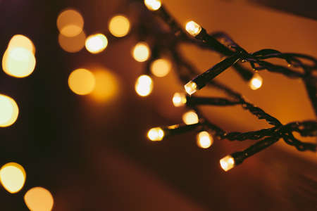 Bokeh light of holiday garland close upの写真素材