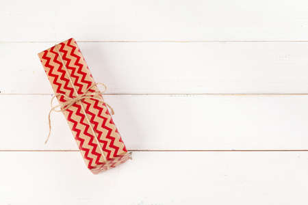 White wooden table with wrapped gifts top viewの写真素材