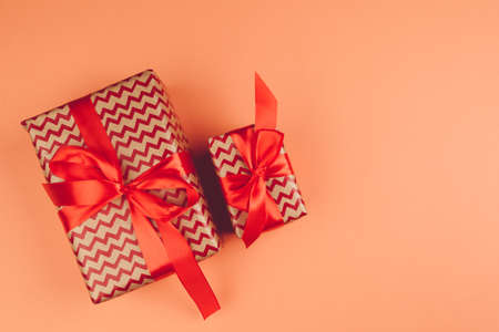 Present with a bow on orange background