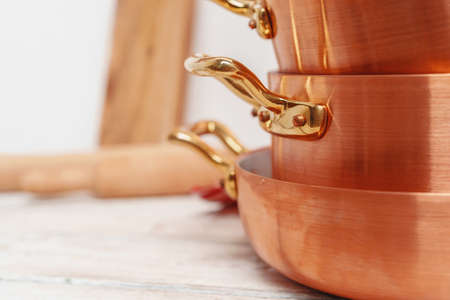 kitchen for professional use with lots of copper potsの写真素材