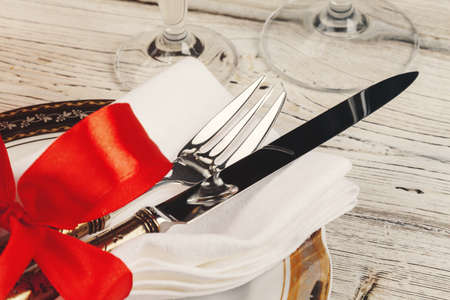 Beautiful red Christmas table setting with decorations close up