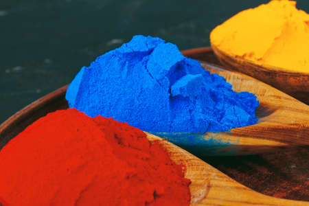 Vibrant Holi powder colors arranged in spoonsの写真素材