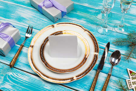 Holiday table setting on wooden table in lilac colorsの写真素材