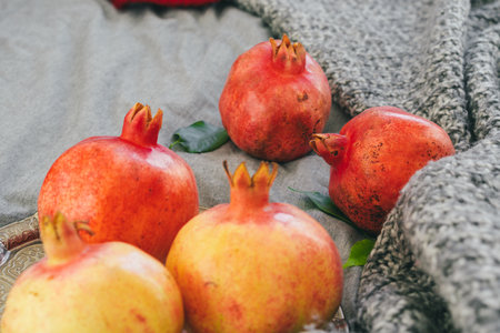 Pomegranate on a gray plaid close upの写真素材