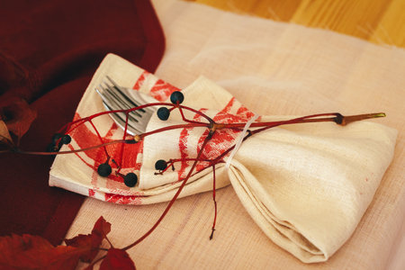 Tableware on kitchen table with autumn decor close upの写真素材