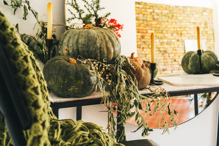 Beautiful autumn table decor with green pumpkinの写真素材