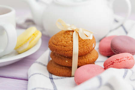 Homemade crunchy cookies and tea on a wooden tableの写真素材