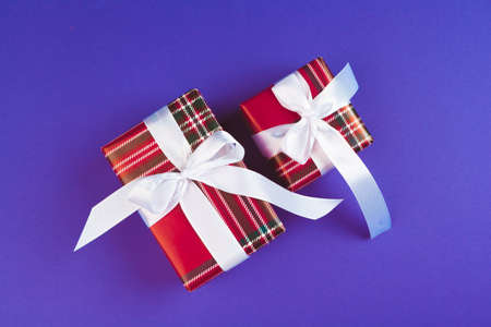 Gift box on purple background top viewの写真素材