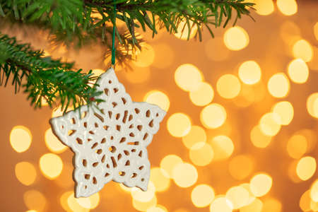 Christmas tree background and Christmas decoration with snowflake on golden bokeh background