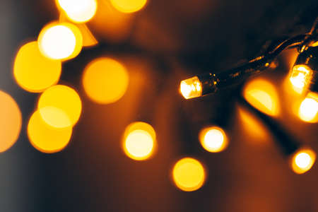 Bokeh light of holiday garland close upの写真素材