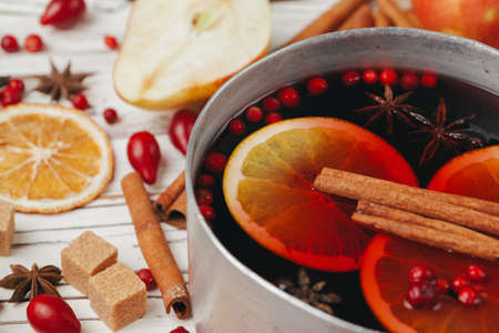 Christmas hot mulled wine in rustic cup close upの写真素材