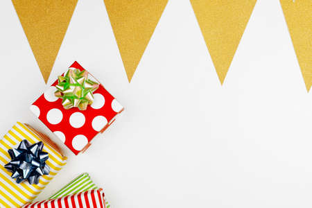Christmas composition of various gift boxes wrapped in bright paper