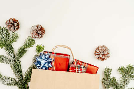 Top view, flat lay of red Christmas gifts on white background