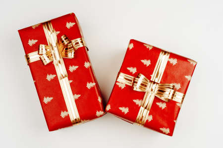 Top view, flat lay of red Christmas gifts on white backgroundの写真素材