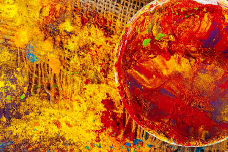 Bows of colorful Holi power close up on floorの写真素材