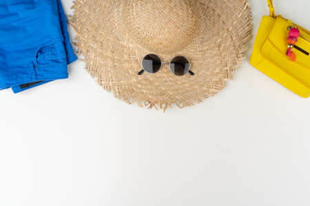 Flat lay of woman summer outfit on white backgroundの写真素材