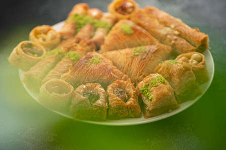 Delicious baklava dessert in oriental setting on black backgroundの写真素材